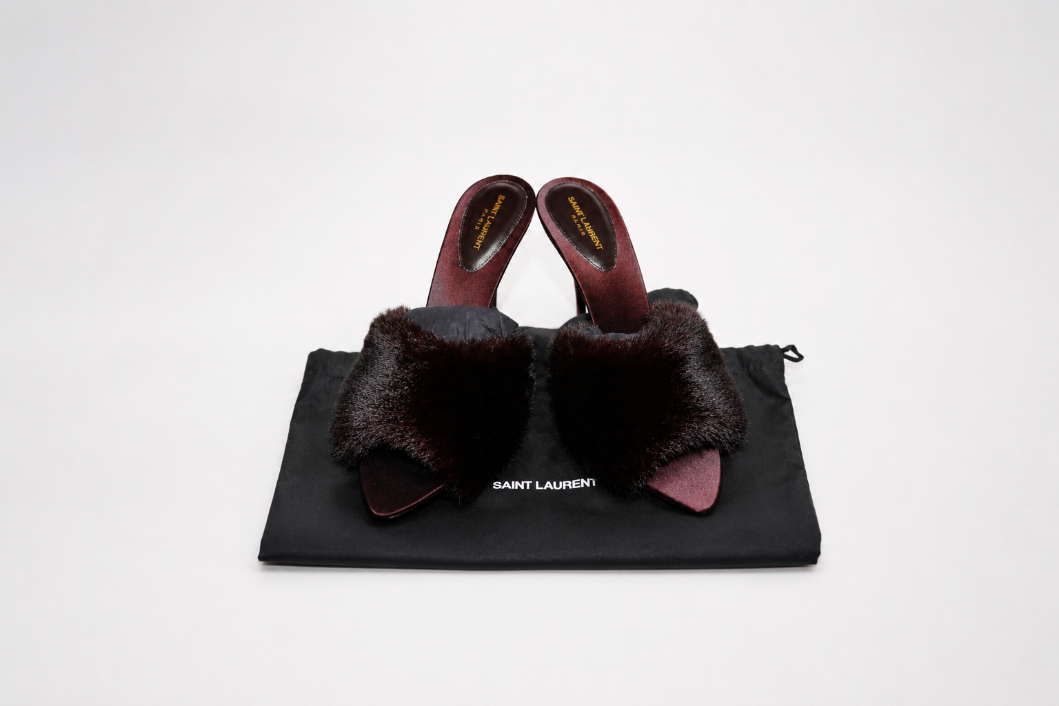 Saint Laurent fur-trimmed mules on their dust bag